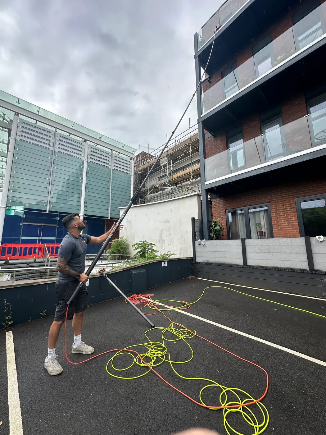 Water-fed pole brush cleaning exterior trim