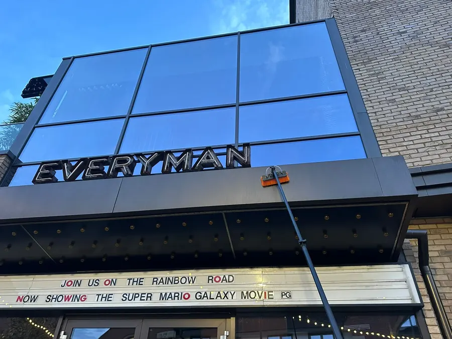 Cleaning the large glass frontage of the Everyman cinema