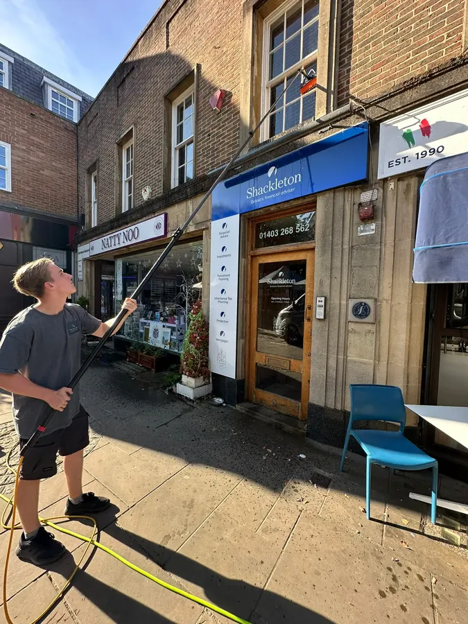 Cleaning a high street shopfront in Horsham